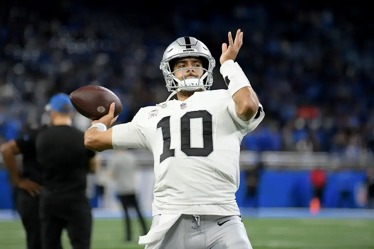 Las Vegas Raiders quarterback Jimmy Garoppolo (10) throws a pass during warmups before their game against the Detroit Lions at Ford Field