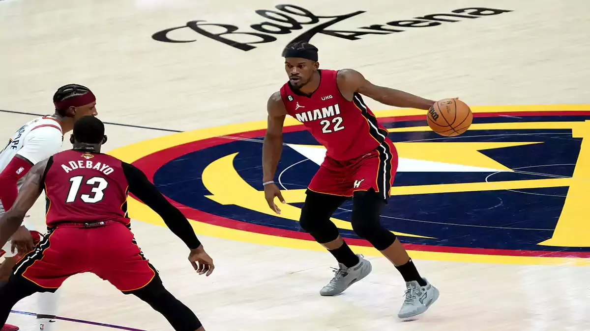 Miami Heat forward Jimmy Butler (22) dribbles during the fourth quarter of game five of the 2023 NBA Finals against the Denver Nuggets at Ball Arena.