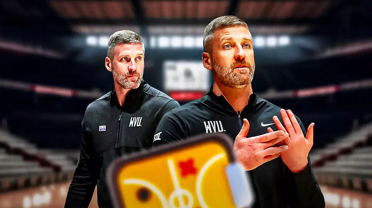 West Virginia basketball coach Josh Eilert looking somber.