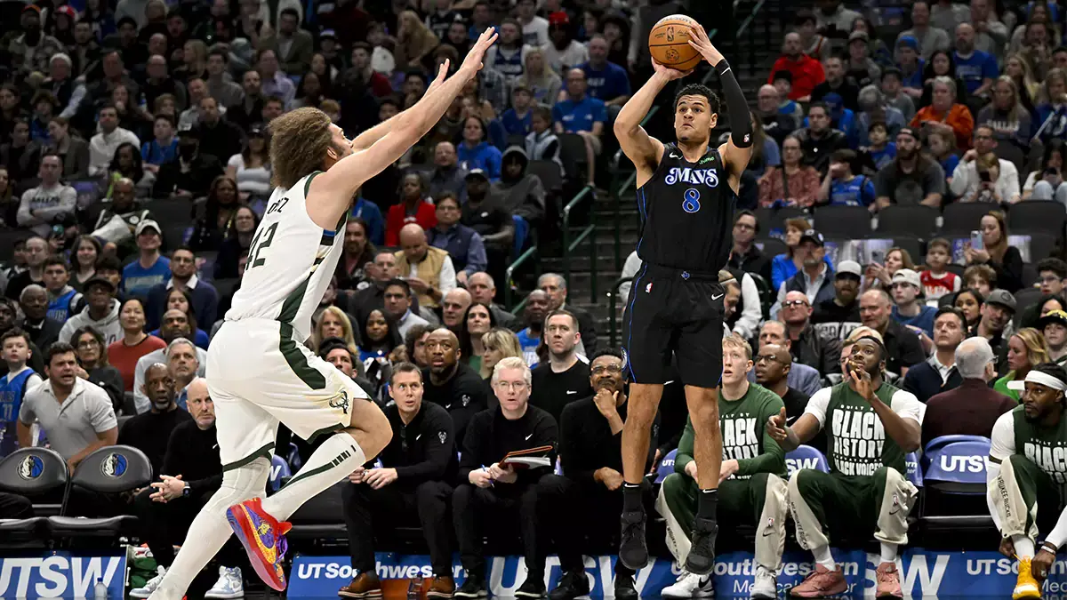 Dallas Mavericks guard Josh Green (8) makes a three point shot over Milwaukee Bucks center Robin Lopez (42) during the first quarter at the American Airlines Center
