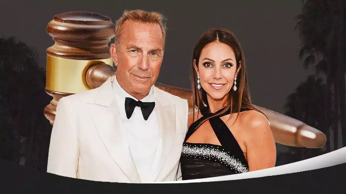 Kevin Costner and Christine Baumgartner with a gavel behind them