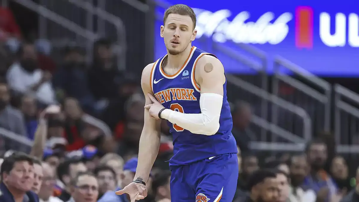 New York Knicks guard Donte DiVincenzo (0) reacts after making a basket during the first quarter against the Houston Rockets at Toyota Center.