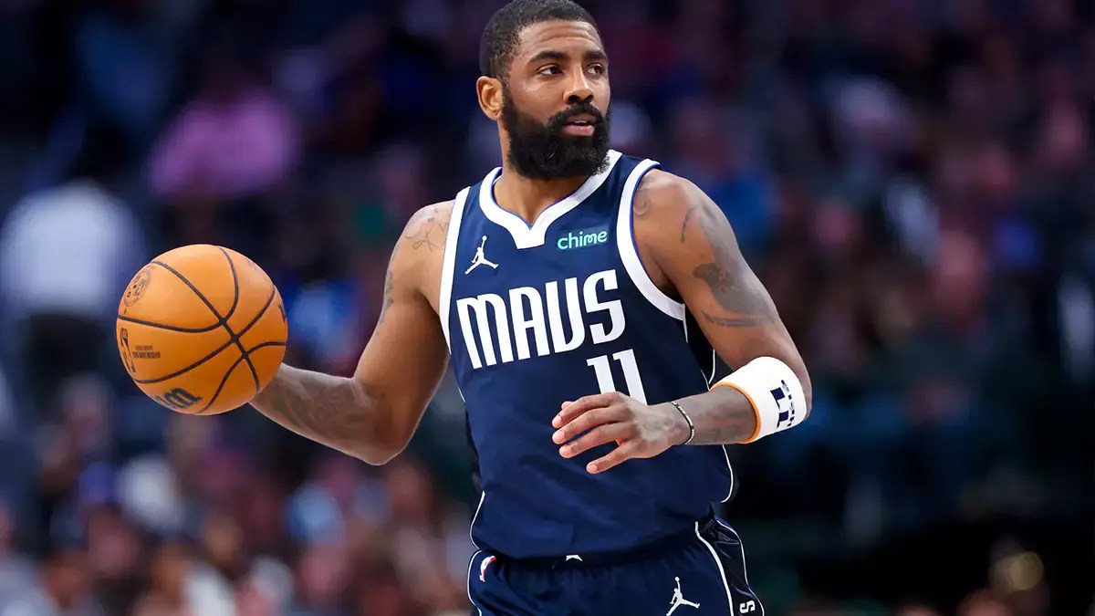 Dallas Mavericks guard Kyrie Irving, 11, dribbles during the second half of a game against the Oklahoma City Thunder at American Airlines Center.