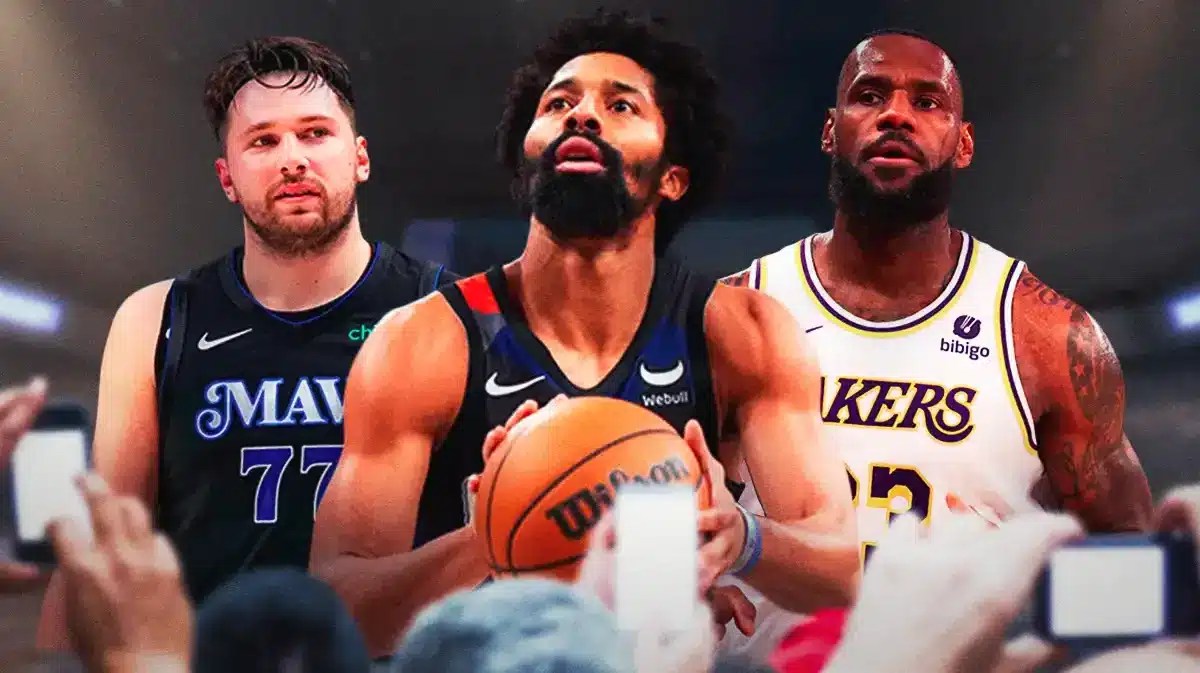 Lakers' LeBron James looking at Spencer Dinwiddie and Luka Doncic also looking.
