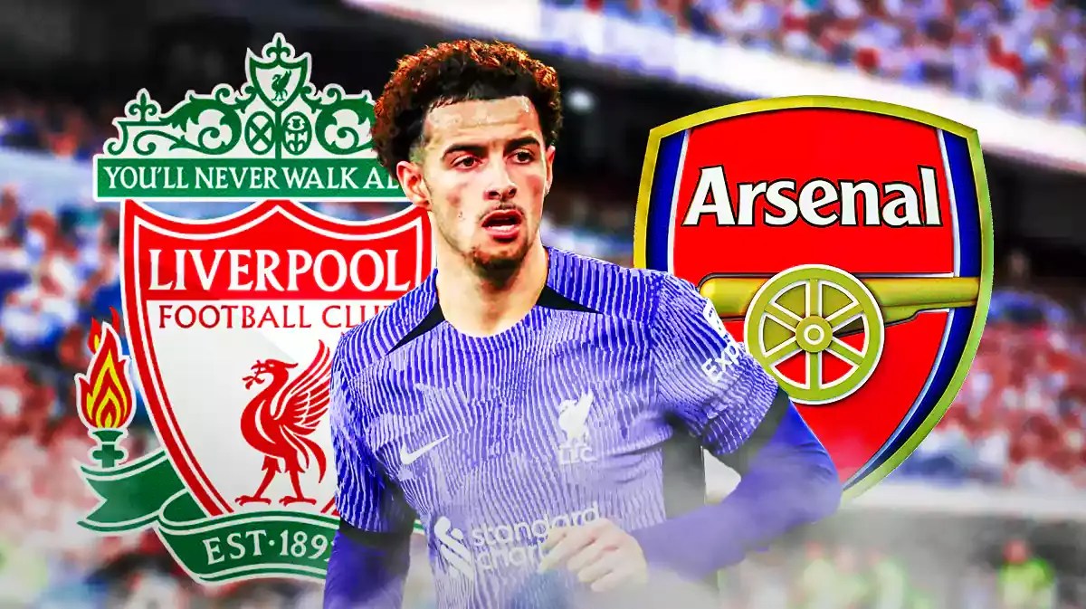 Curtis Jones in front of the Liverpool and Arsenal logos