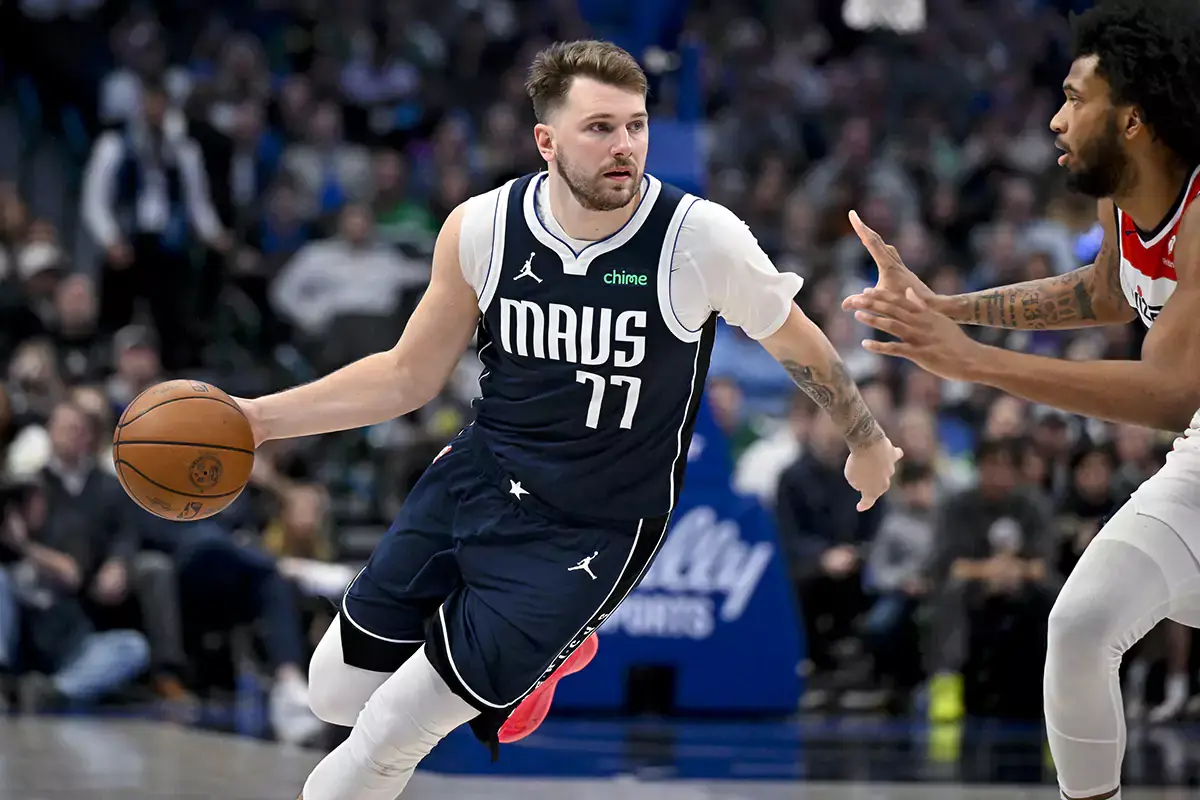 Dallas Mavericks guard Luka Doncic (77) brings the ball up court against the Washington Wizards during the second half at the American Airlines Center.
