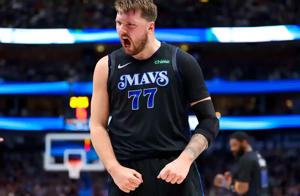 Dallas Mavericks guard Luka Doncic (77) reacts during the first half against the Phoenix Suns at American Airlines Center.