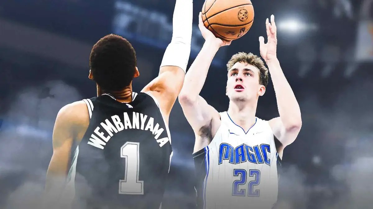 Jonathan Isaac blocking Victor Wembanyama and have Moritz Wagner boxing out for a rebound in the KIA Center.