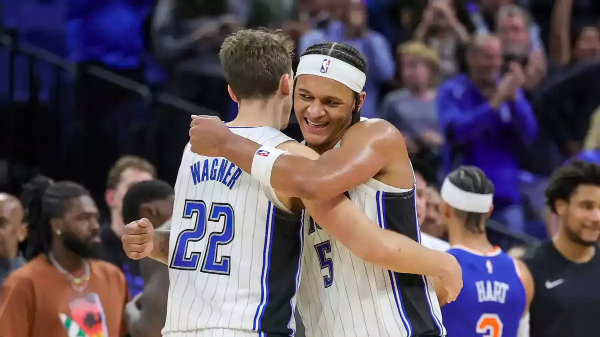 Orlando Magic forward Franz Wagner (22) and forward Paolo Banchero (5) celebrate their 117-108 win against the New York Knicks at KIA Center.