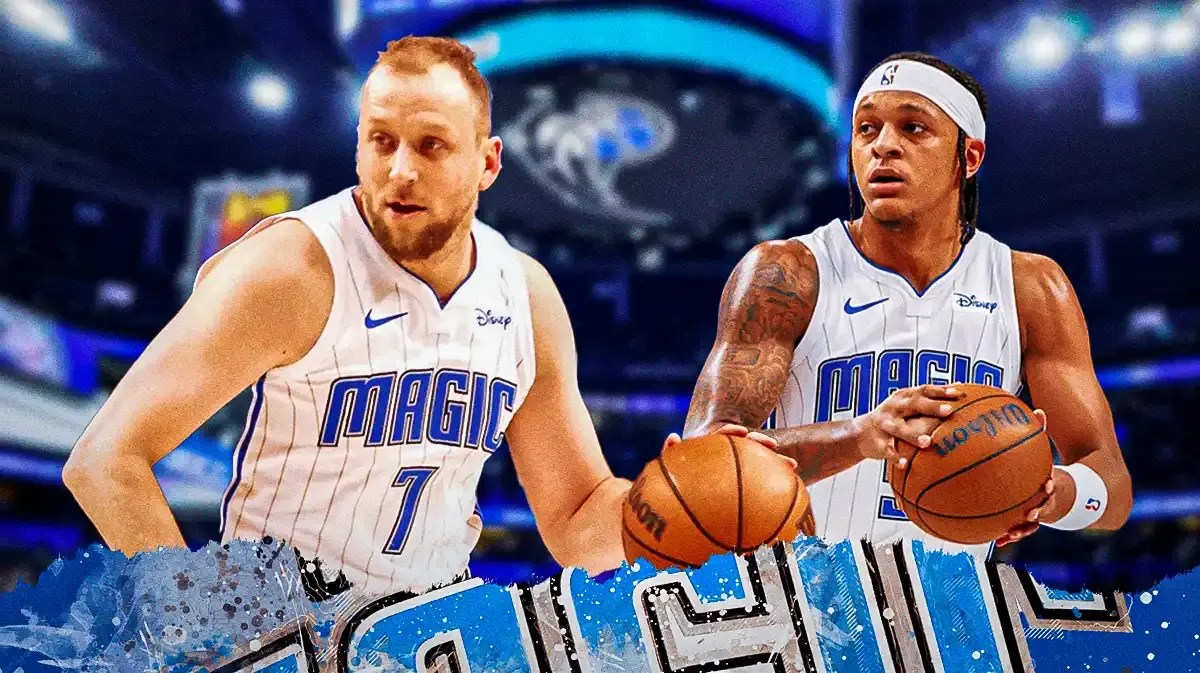 Photo: Paolo Banchero and Joe Ingles in Magic gear with Magic logo behind them