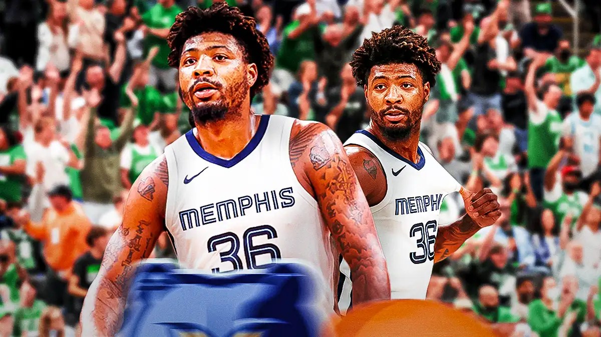 Memphis Grizzlies guard Marcus Smart looking as Celtics fans cheer him.