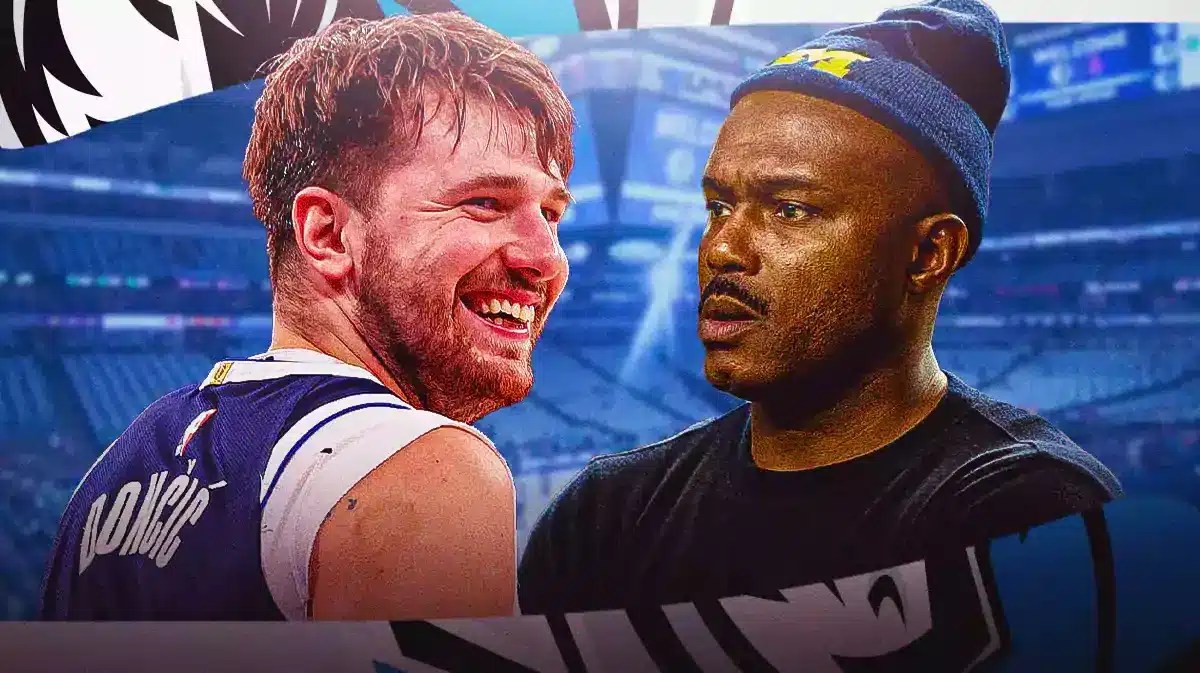 Tim Hardaway in street clothes looking at Luka Doncic