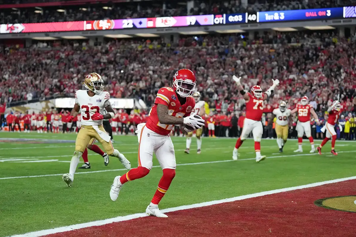 Kansas City Chiefs wide receiver Mecole Hardman Jr. (12) scores a touchdown against the San Francisco 49ers in overtime during Super Bowl LVIII at Allegiant Stadium.