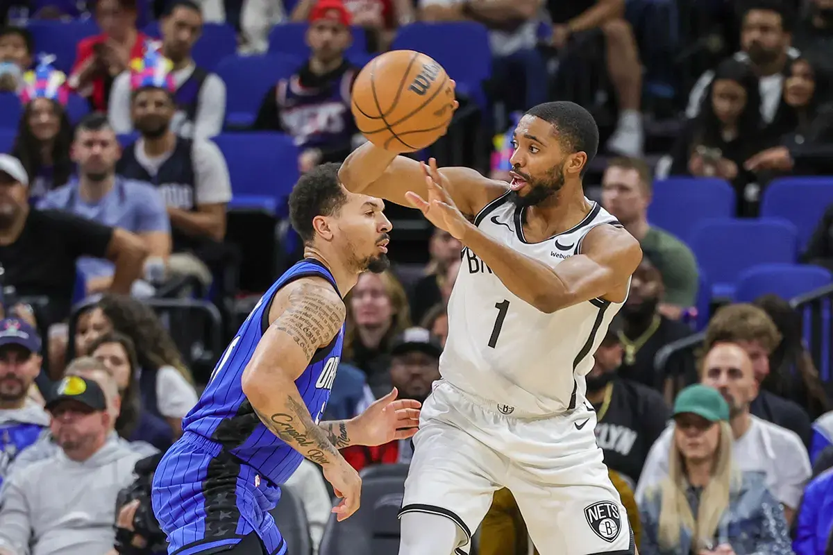 Brooklyn Nets forward Mikal Bridges (1) passes the ball around Orlando Magic guard Cole Anthony (50) during the second quarter at Amway Center.