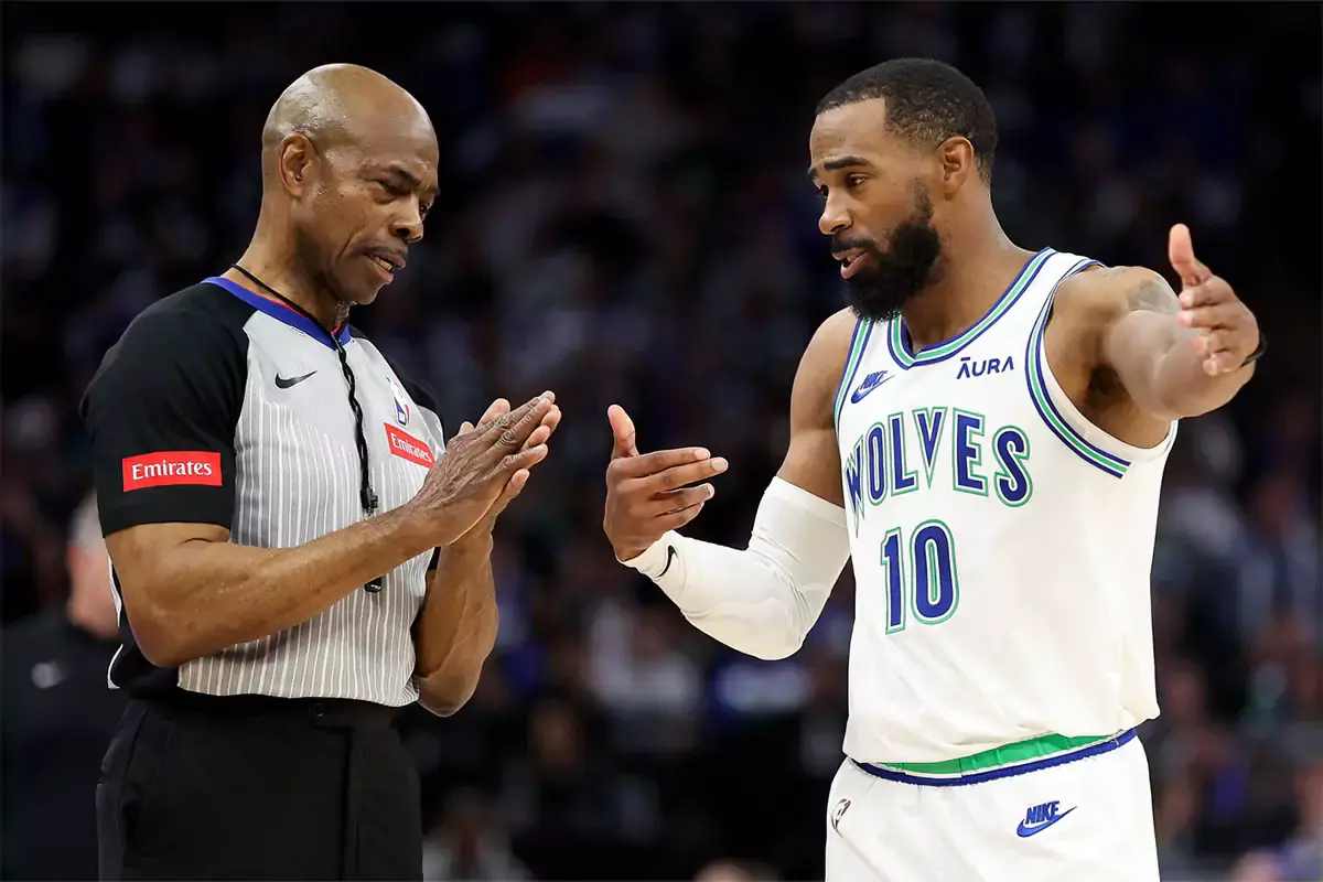 Minnesota Timberwolves guard Mike Conley (10) talks to referee Tom Washington (49) during the second half against the Brooklyn Nets at Target Center.