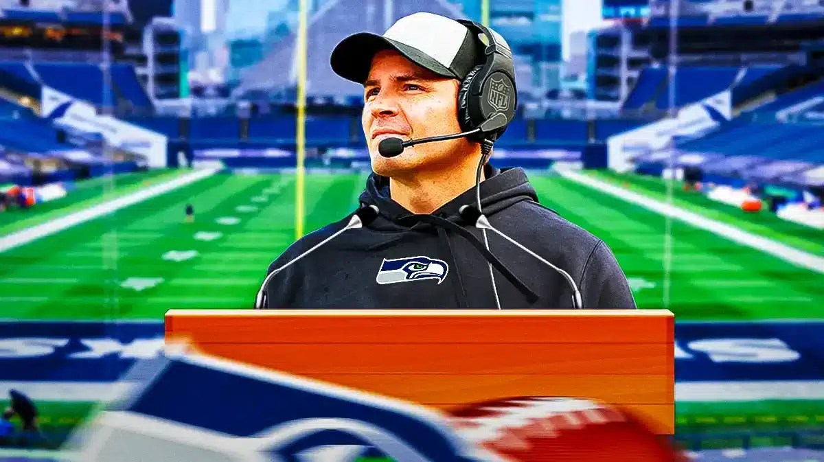 Seahawks coach Mike Macdonald at a podium