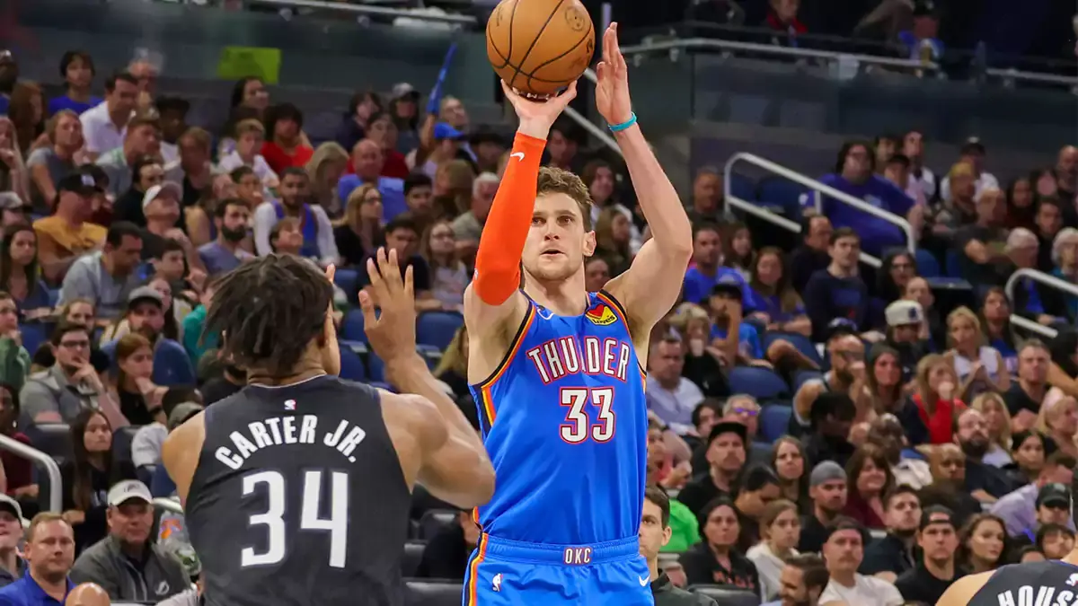 Oklahoma City Thunder center Mike Muscala (33) shoots a three point basket against Orlando Magic center Wendell Carter Jr. (34) during the second quarter at Amway Center.