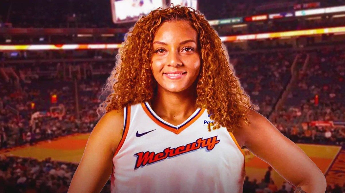 Mikiah Herbert Harrigan in a Phoenix Mercury jersey with the Mercury arena in the background