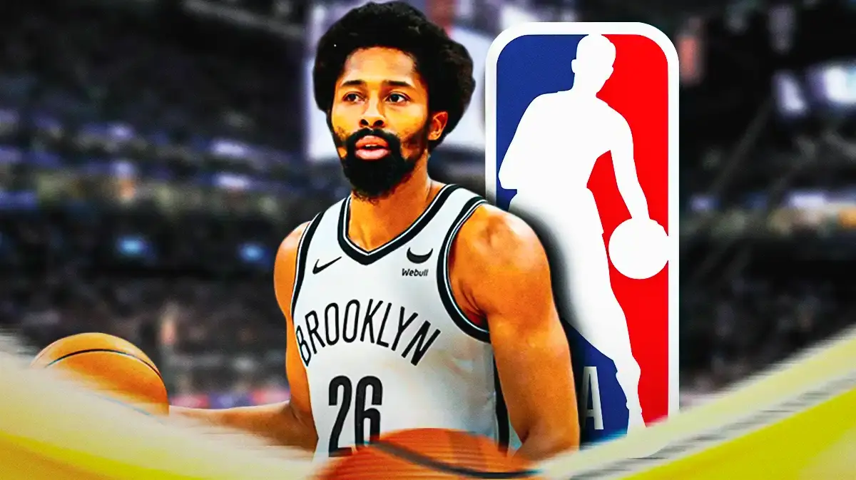 Spencer Dinwiddie stands in front of Nets and NBA logo amid rumors ahead of the trade deadline