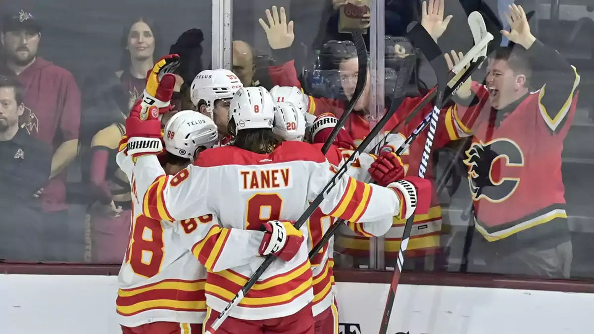 Noah Hanifin and Chris Tanev on Calgary Flames.
