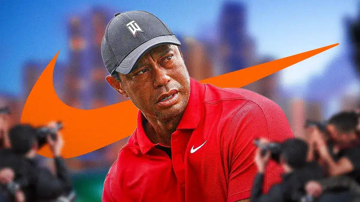 Tiger Woods golfs in Nike apparel