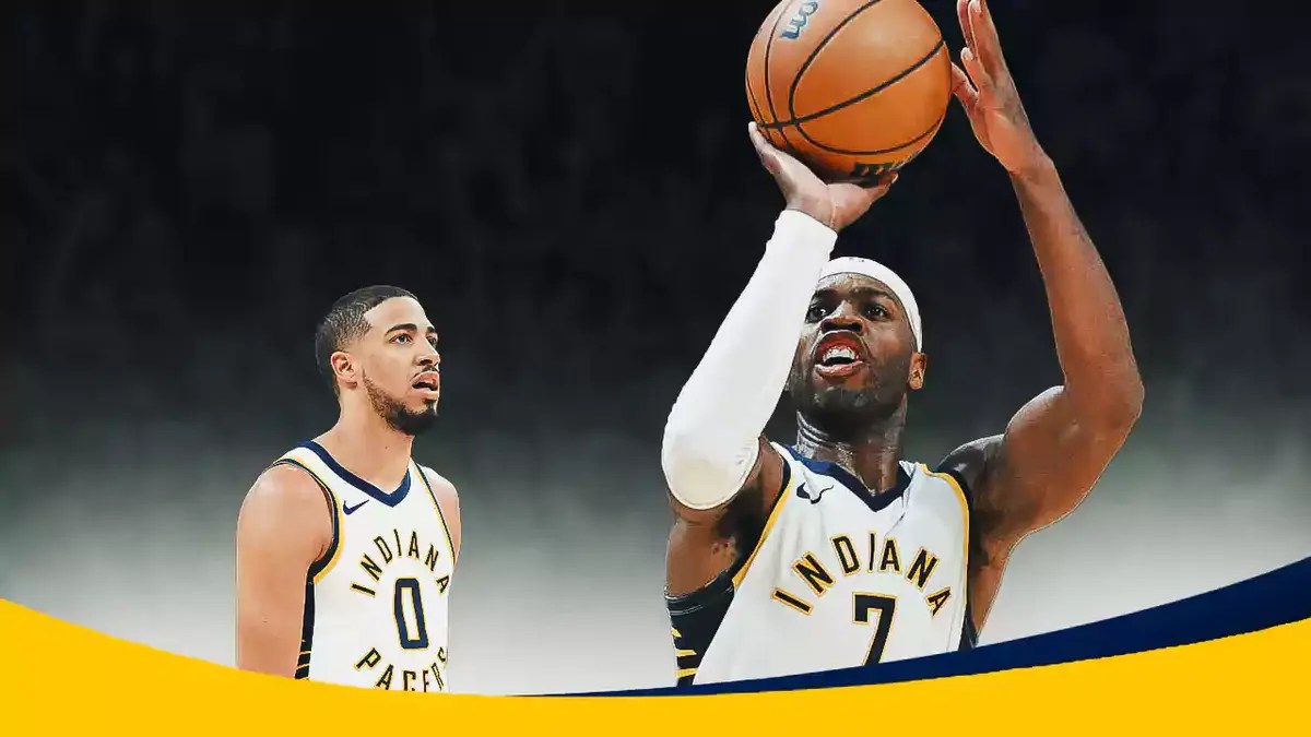 Pacers' Tyrese Haliburton looking angry, with Buddy Hield in his shooting motion while his hands are frozen