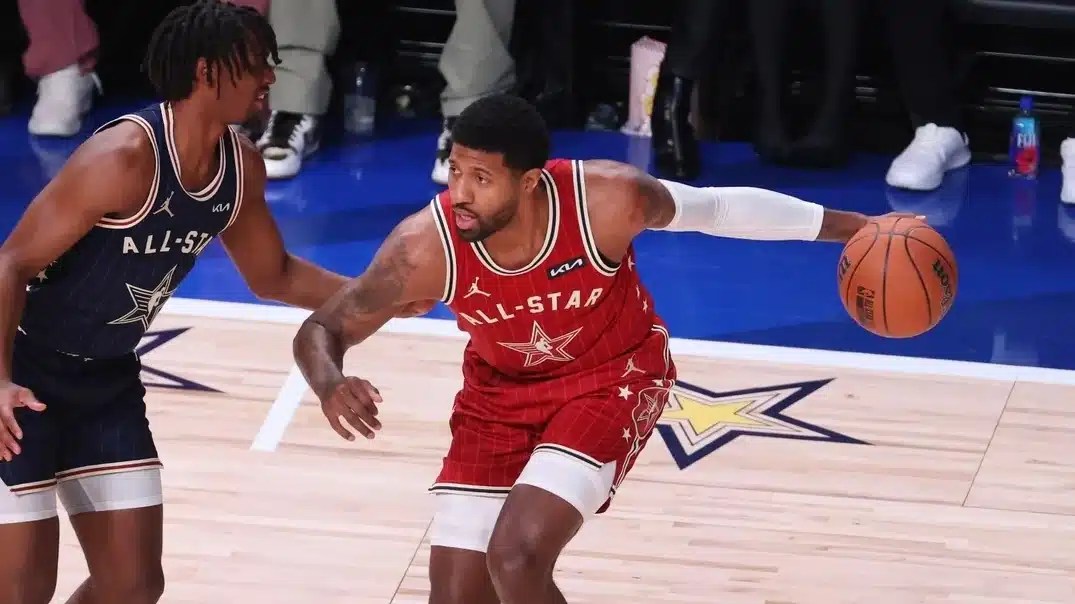 Indianapolis, Indiana, USA; Western Conference forward Paul George (13) of the LA Clippers dribbles the ball against Eastern Conference guard Tyrese Maxey (0) of the Philadelphia 76ers during the second quarter in the 73rd NBA All Star game at Gainbridge Fieldhouse.