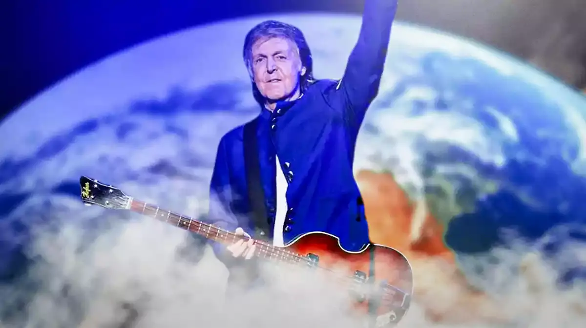 Paul McCartney with Höfner violin Beatle bass and globe background.