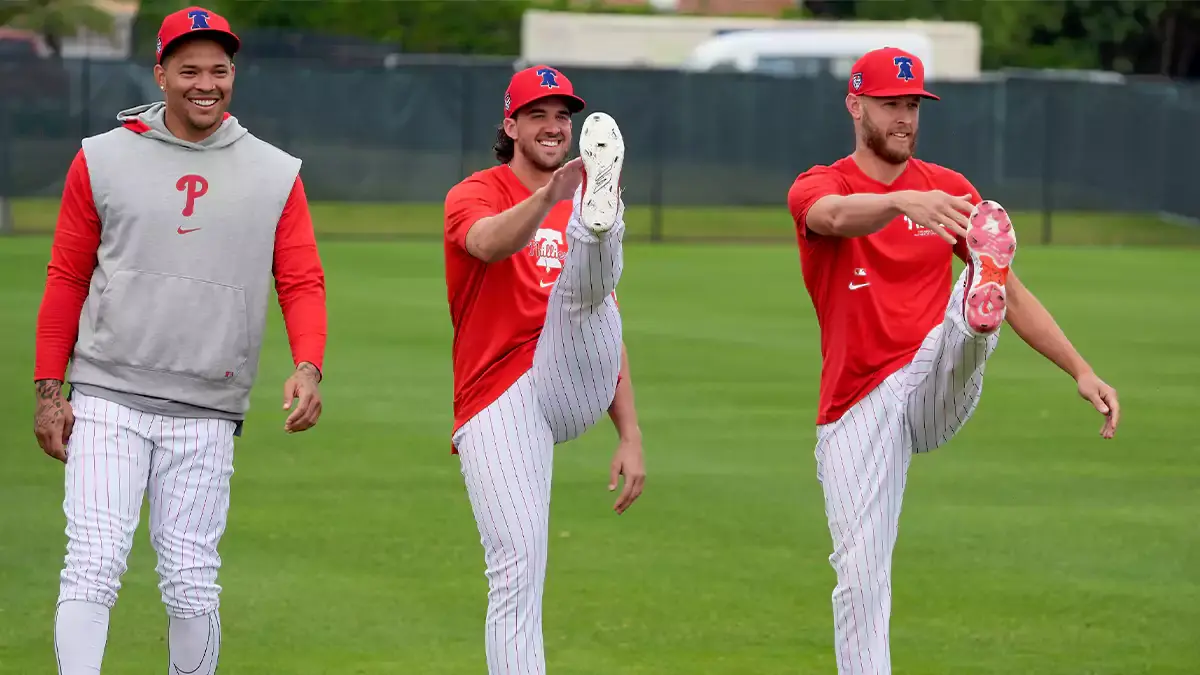 Philadelphia Phillies pitchers Taijuan Walker (left), Aaron Nola (center) and Zach Wheeler (right) warm up at Phillies Spring Training.