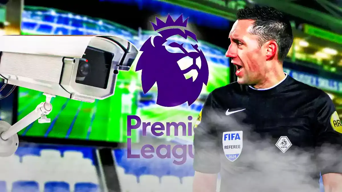 A referee looking at the VAR cameras, the Premier League logo behind him