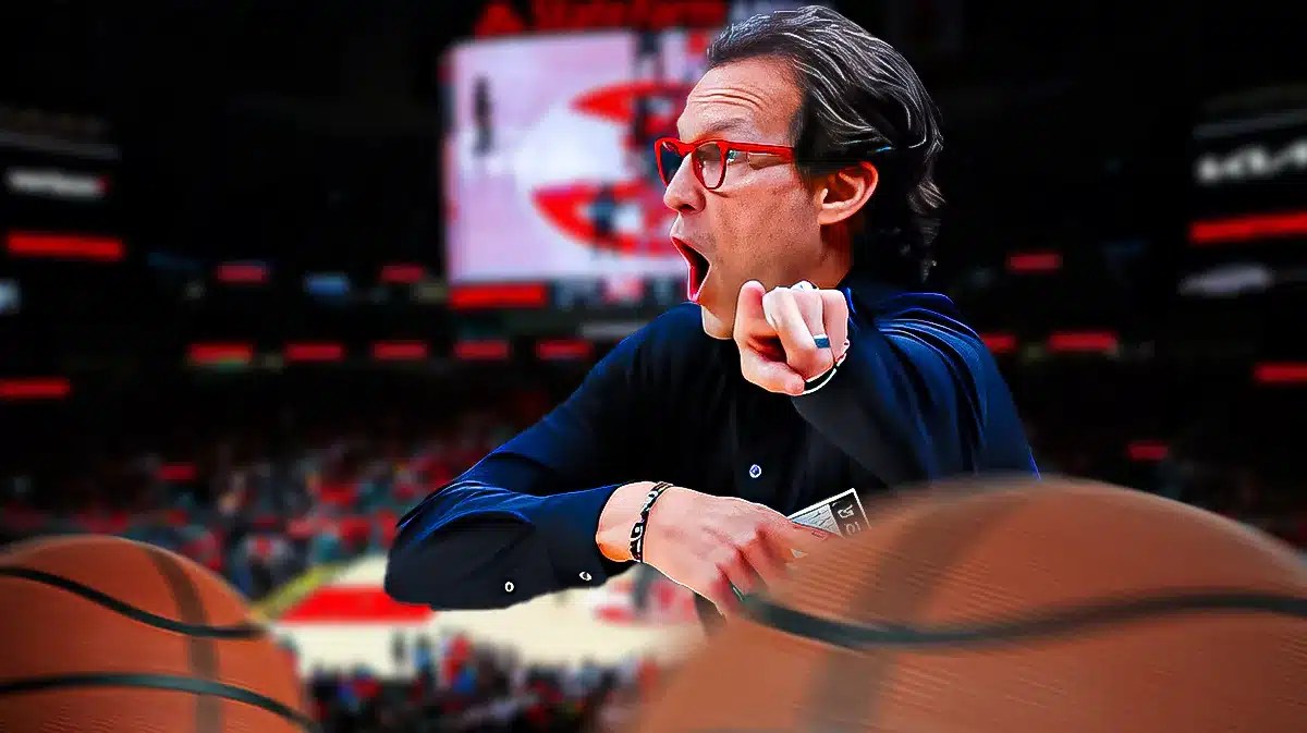 Quin Snyder looking angry with the Hawks arena in the background, ejected