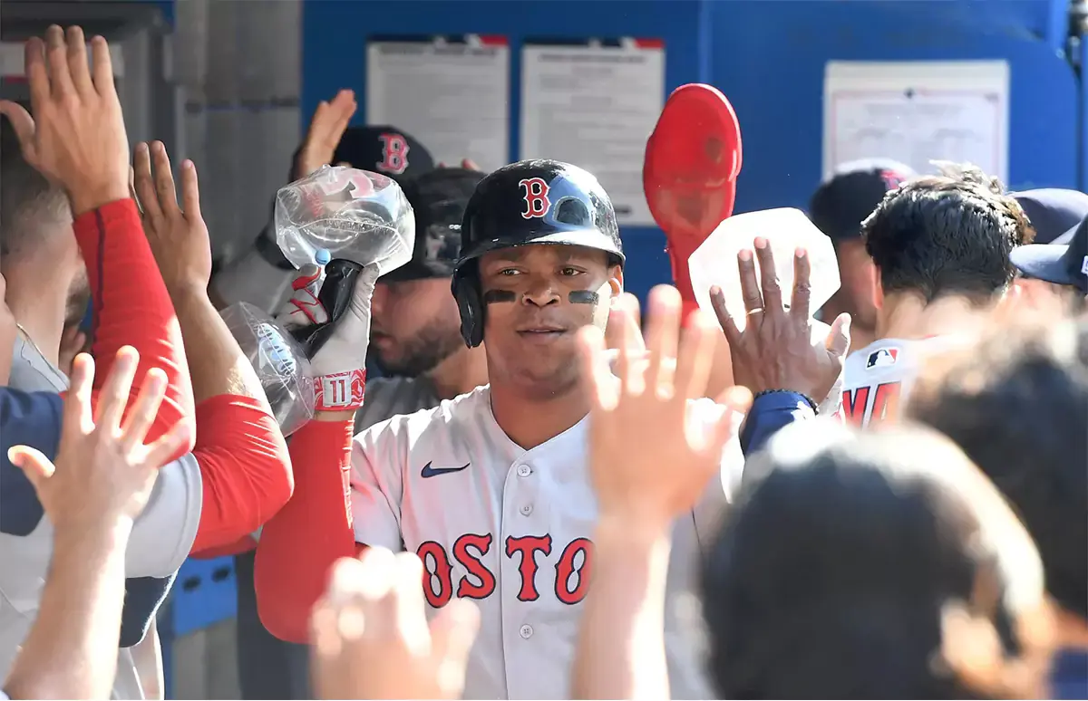 Boston Red Sox third baseman Rafael Devers (11) celebrates teammates after hitting a two run home run against the Toronto Blue Jays in the sixth inning at Rogers Centre