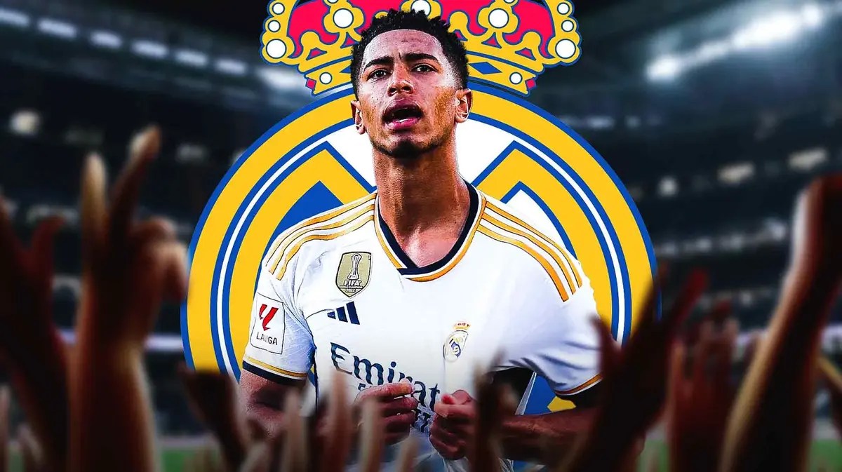 Jude Bellingham in front of the Real Madrid logo