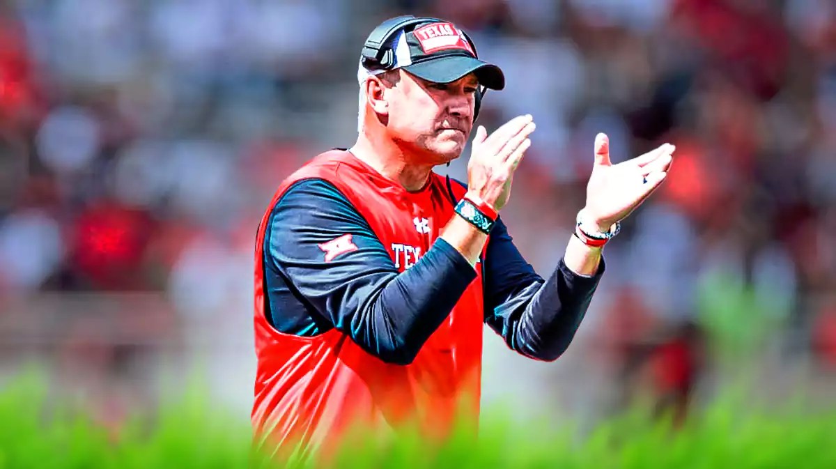 Texas Tech football coach Joey McGuire clapping his hands.