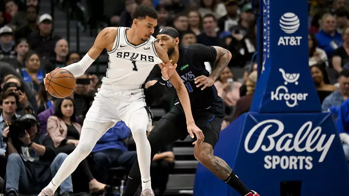San Antonio Spurs center Victor Wembanyama (1) looks to move the ball past Dallas Mavericks center Daniel Gafford (21) during the second quarter at the American Airlines Center.