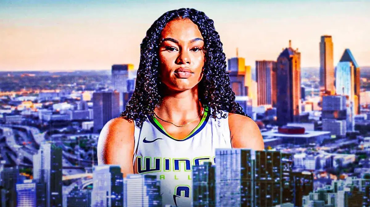 Wings' Satou Sabally smiling with the city of Dallas, TX in the background.