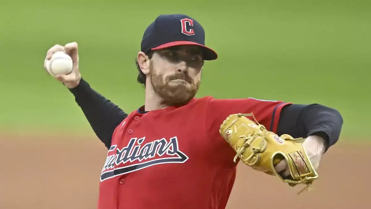 Cleveland Guardians starting pitcher Shane Bieber (57) delivers a pitch in the first inning against the Cincinnati Reds at Progressive Field.