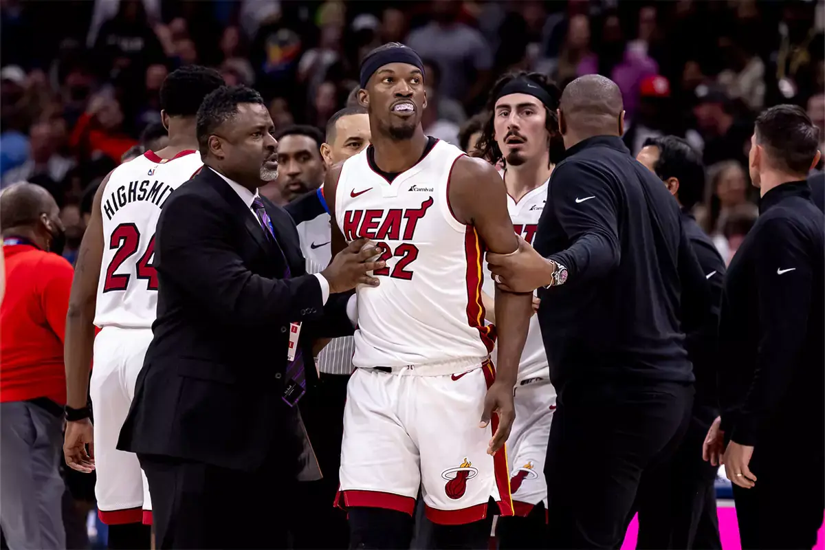 Miami Heat forward Jimmy Butler (22) and New Orleans Pelicans forward Naji Marshall (8) and guard Jose Alvarado (15) are ejected after a melee due to a play during the second half at Smoothie King Center.