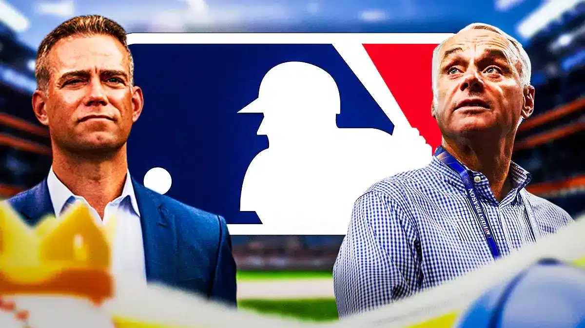 Theo Epstein and Rob Manfred in front of MLB logo