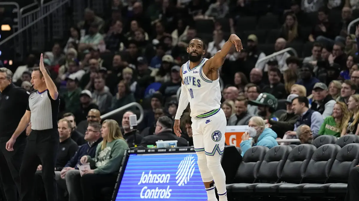 Minnesota Timberwolves guard Mike Conley (10) reacts after scoring a basket during the third quarter against the Milwaukee Bucks at Fiserv Forum.