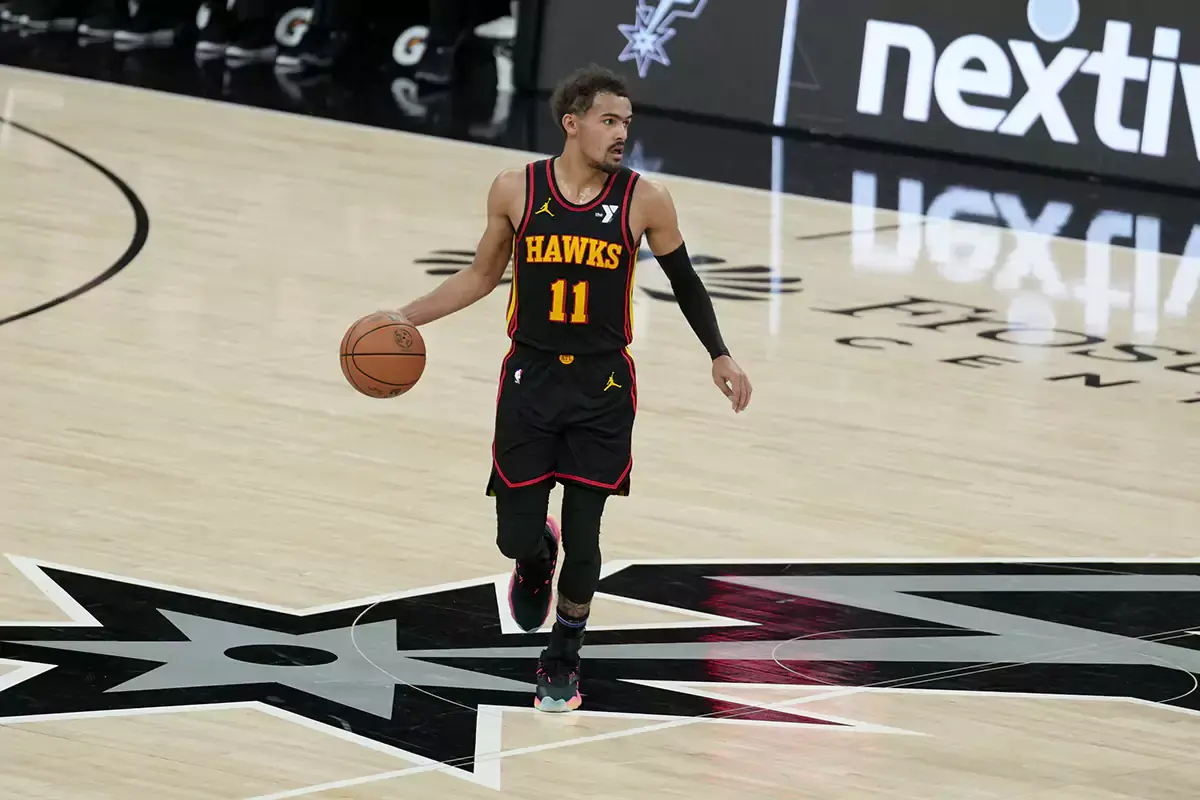 Atlanta Hawks guard Trae Young (11) dribbles the ball in the first half against the San Antonio Spurs at the Frost Bank Center.
