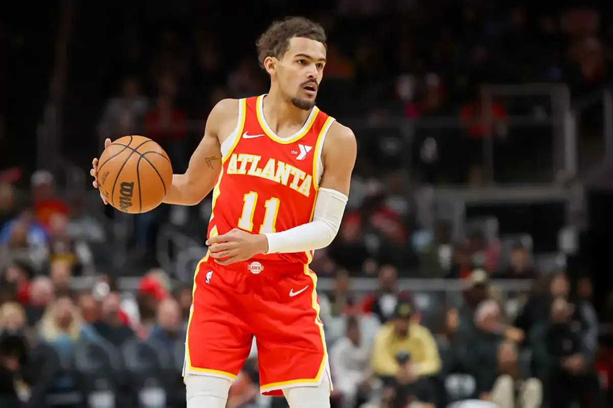 Atlanta Hawks guard Trae Young (11) handles the ball against the Houston Rockets in the first quarter at State Farm Arena