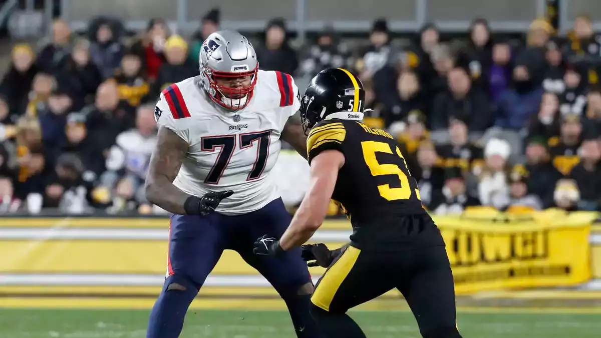 New England Patriots offensive tackle Trent Brown (77) blocks against Pittsburgh Steelers linebacker Nick Herbig (51) during the third quarter at Acrisure Stadium