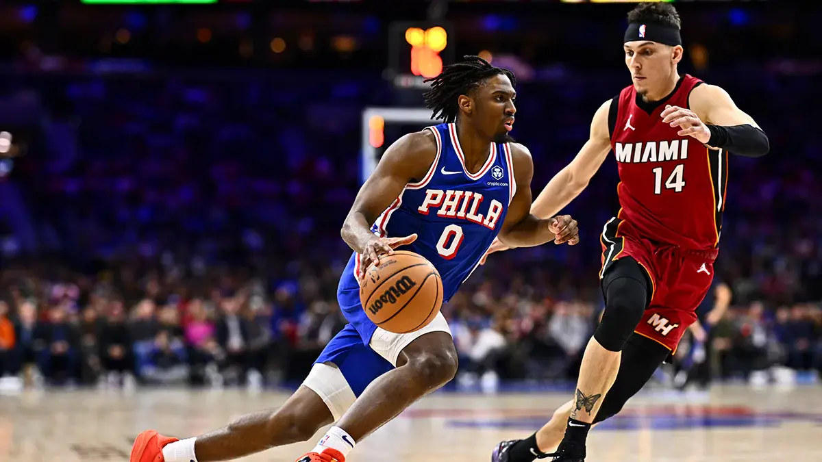 Philadelphia 76ers guard Tyrese Maxey (0) drives against Miami Heat guard Tyler Herro (14) in the fourth quarter at Wells Fargo Center