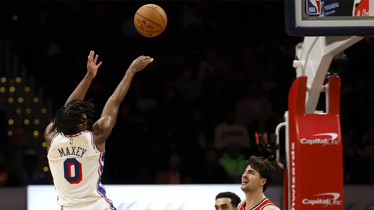Philadelphia 76ers guard Tyrese Maxey (0) shoots the ball as Washington Wizards forward Deni Avdija (8) looks on in the second half at Capital One Arena