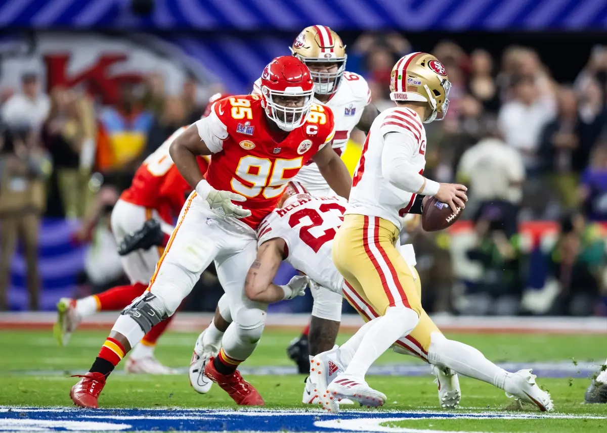 Kansas City Chiefs defensive tackle Chris Jones (95) pursues San Francisco 49ers quarterback Brock Purdy in Super Bowl LVIII at Allegiant Stadium.