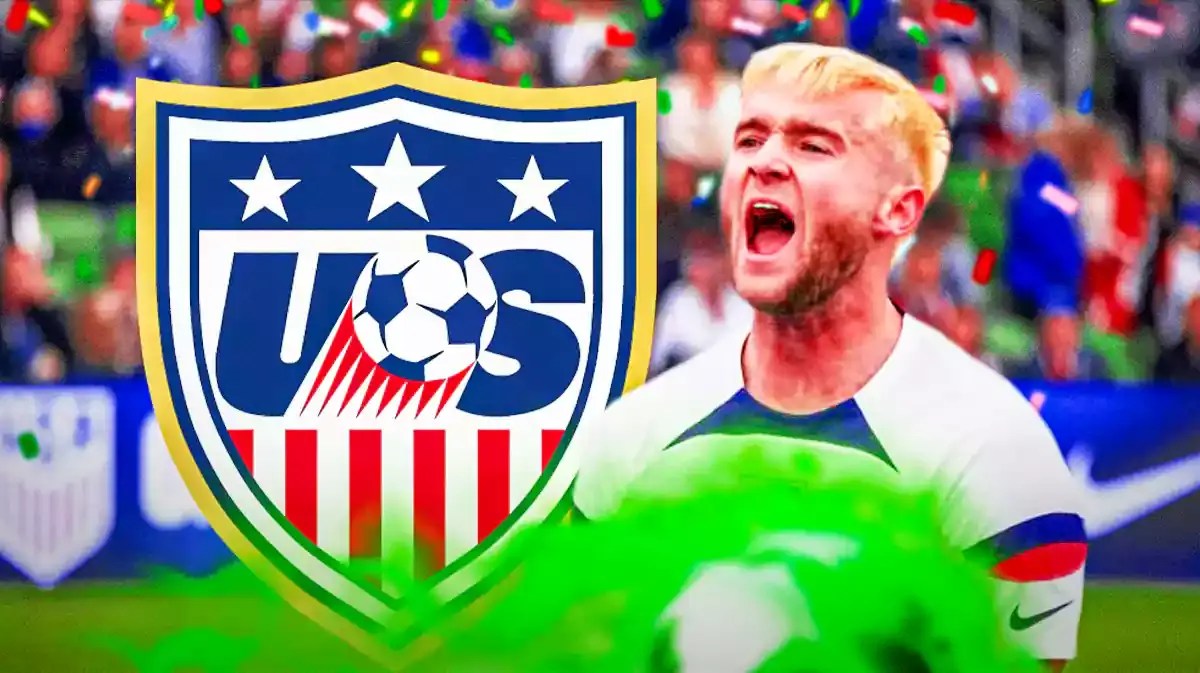 Duncan McGuire celebrating in front of the USMNT logo