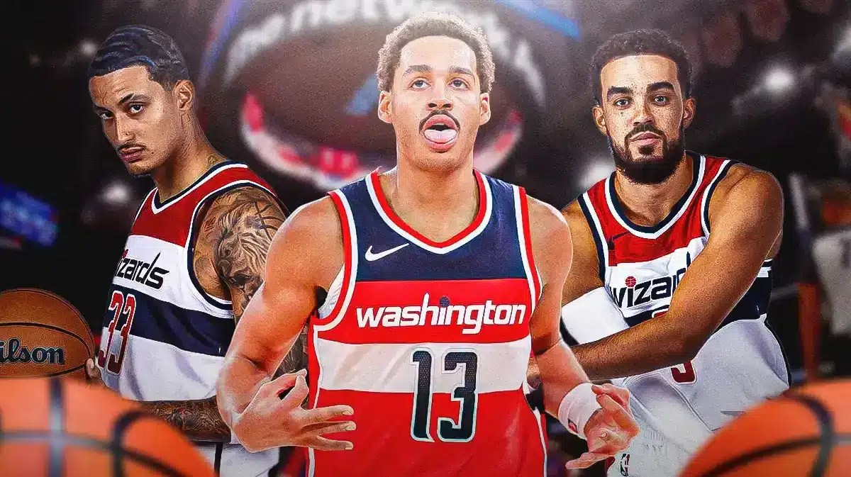 Jordan Poole next to Kyle Kuzma and Tyus Jones