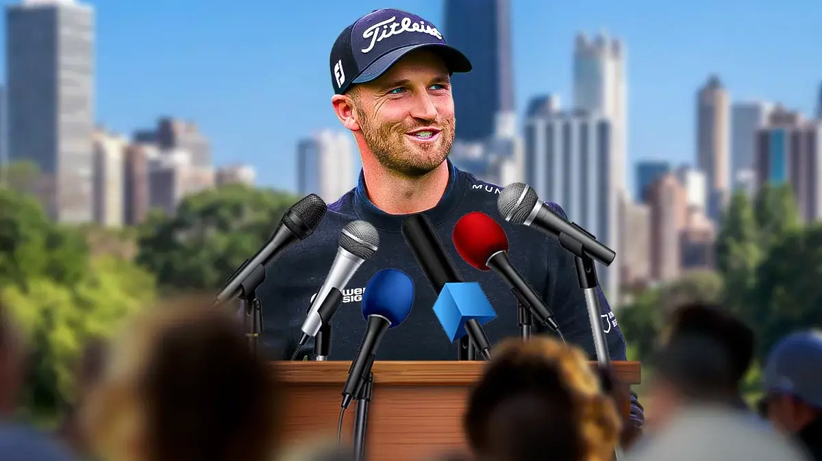 Wyndham Clark speaking at a microphone