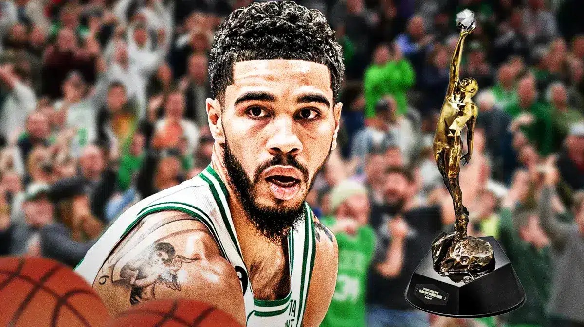 Celtic' Jayson Tatum next to the MVP award.